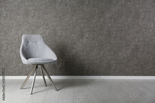 Grey modern chair for interior design on wooden floor at gray wall