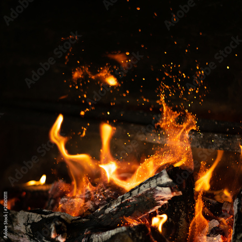 fire flames in bonfire stove isolated with balck