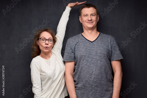 Shot of funny short woman and tall man