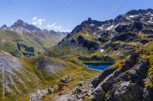 The Lac Bleu in Chianale, mountain lake in the italian alps of Cuneo, Piedmont, facing the famous Monviso peak, or mount viso