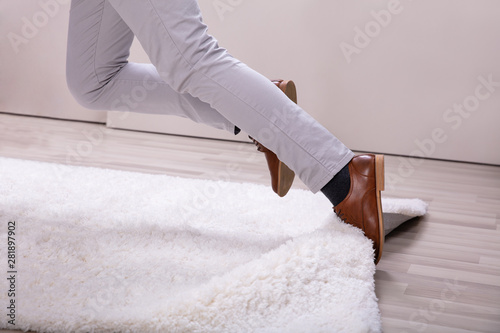 Man Stumble In A Carpet Near Ladder