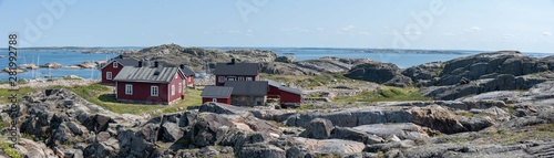 Ursholmen, Sweden - July 26, 2019: View of the red houses on Ursholmen Island in the Swedish Kosterhavet National Park in western Sweden.