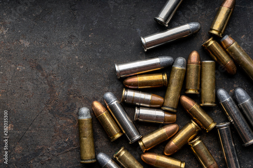 Hand guns , ammo ,Guns with ammunition on Dark background. 