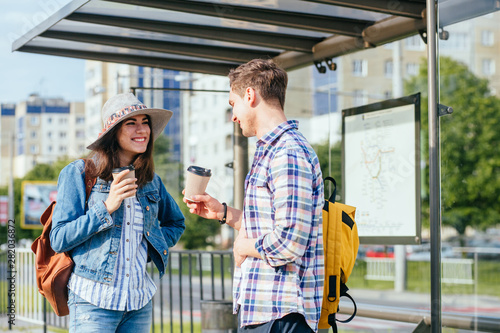 Language barrier concept. Handsome man talking to an attractive young woman with question mark