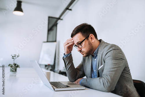 Businessman stressed out at work in casual office