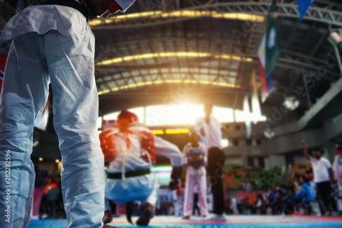 Moment of Taekwondo player in the stadiums with Coach standing. Athlete to strike an opponent during the tournament taekwondo.