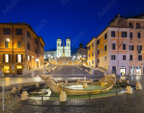 Night view of Spanish Steps and Fontana della Barcaccia in Rome, Italy.
