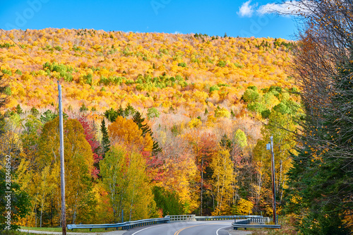 Highway at autumn day in Maine, USA.