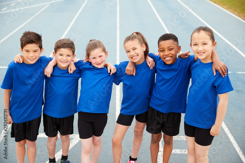 Portrait Of Children In Athletics Team On Track On Sports Day