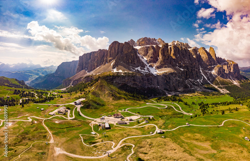 Aerial top view from drone to wonderful alpine landscape and meadows at Pass Gardena with majestic Sella mountain group in Dolomiti. Alps, South Tirol, Dolomites mountains, passo di Val Gardena, Italy