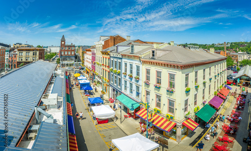 Aerial view of colorful houses at Findlay market in the re-gentrified, up and coming neighborhood Over the Rhine in Cincinnati Ohio USA with street vendors on a sunny summer morning