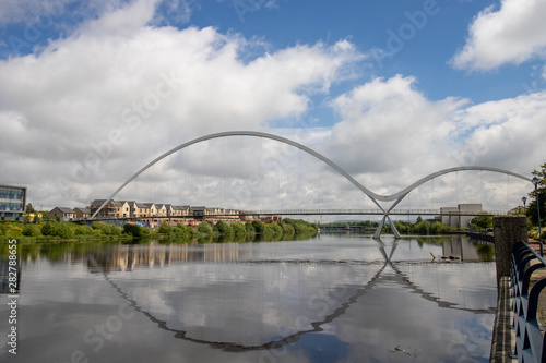 The famous Infinity Bridge located in Stockton-on-Tees taken on a bright sunny part cloudy day.