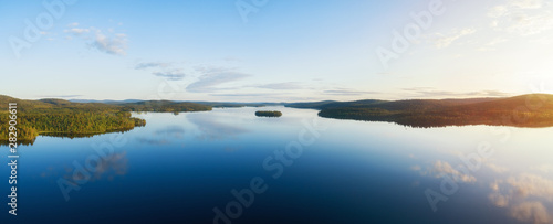 Aerial panorama of beautiful lake Inari, islands and green forest at sunset. Inarijarvi,Lapland