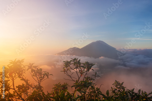 Mounts Abang and Agung during sunrise, view from Batur volcano on Bali Island, Indonesia