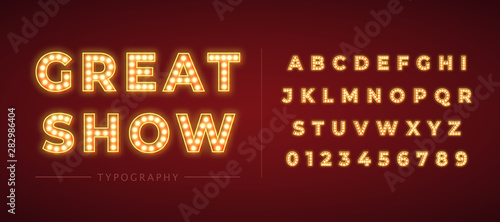 3d light bulb alphabet with gold frame isolated on dark red background.