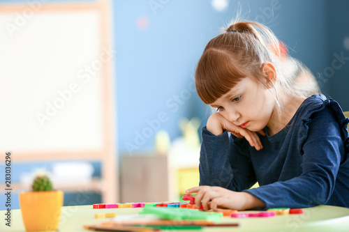 Little girl with autistic disorder in playroom