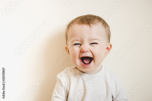 Baby with flu laughing