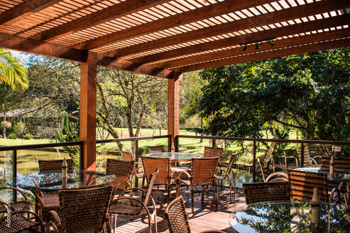 wood pergola and tables in garden farm