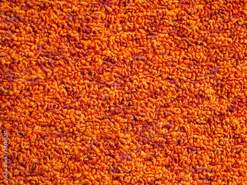 The texture of the carpet is bright orange. Background and pattern