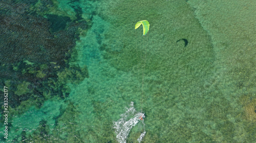 Aerial drone photo of kite surfers practising in famous bay of Loutsa or Artemida, Attica, Greece