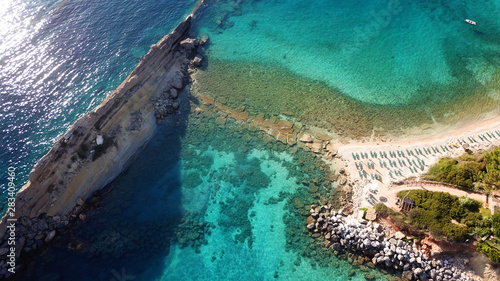 Aerial drone photo of iconic white rock cliffs and volcanic formations near famous beach of Platys and Makrys gialos with turquoise clear sea, Argostoli, Cefalonia island, Ionian, Greece