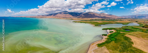 Aerial view of Lake Van the largest lake in Turkey, lies in the far east of that country in the provinces of Van and Bitlis. Fields and cliffs overlooking the crystal clear waters