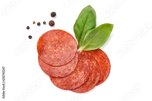 Chorizo sausage slices, Traditional spanish sausage, isolated on white background