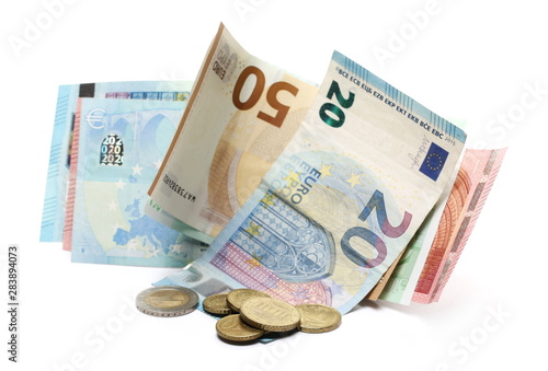 Euro banknotes with change, cash money and coins isolated on white background