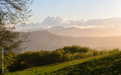 Apennines mountain landscape seen from the "Piana degli Ossi" at sunset time, a wide valley near Firenzuola, on the path of the Gods road or "la via degli Dei", in Italy