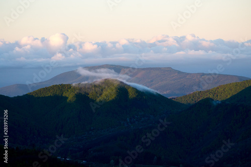 Apennines mountain landscape seen from the "Piana degli Ossi" at sunrise time in the morning, a wide valley near Firenzuola, on the path of the Gods road or "la via degli Dei", in Italy