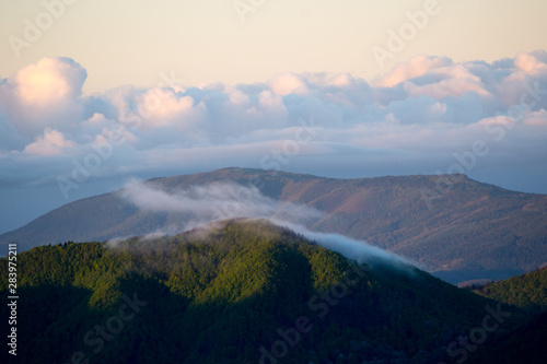 Apennines mountain landscape seen from the "Piana degli Ossi" at sunrise time in the morning, a wide valley near Firenzuola, on the path of the Gods road or "la via degli Dei", in Italy