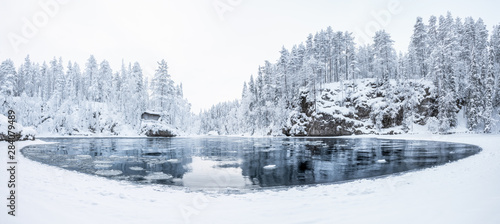 Aerial panorama view of a river in Myllykoski at winter in Oulanka National Park, Finland