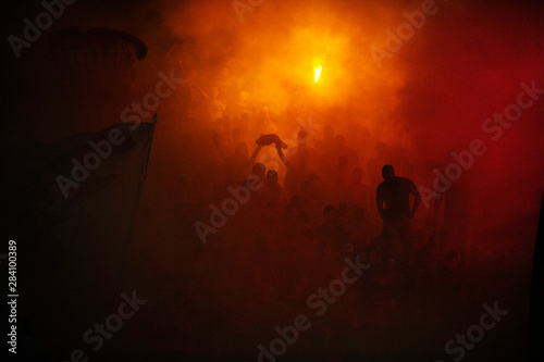 Fans of serbian soccer team FC Red Star lit torches ofter team scored a goal