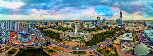 NUR-SULTAN, KAZAKHSTAN (QAZAQSTAN) - August 11, 2019: Beautiful panoramic aerial drone view to Nursultan (Astana) city center with skyscrapers and Baiterek Tower - symbol of Kazakh people freedom