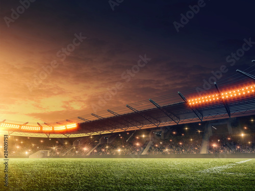 Soccer stadium with illuminated tribunes. Sports event. Night dramatic sky.