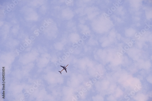 A plane in the cloudy sky