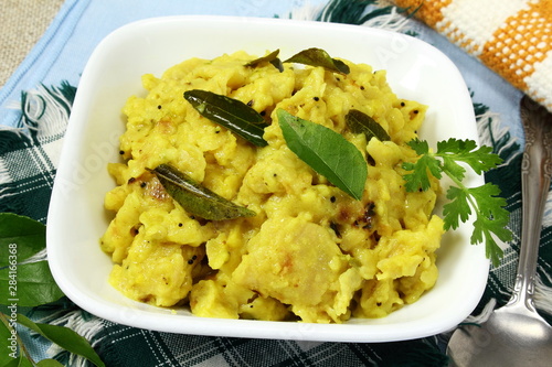indian gujarati traditional food stir fry/vaghareli/tadka/chaunk roti bhakhri make with yogurt gravy and spice curry