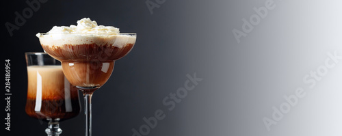 Two coffee cocktails with whipped cream.