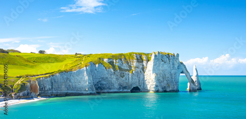 Picturesque panoramic landscape on the cliffs of Etretat. Natural amazing cliffs. Etretat, Normandy, France, La Manche or English Channel. Coast of the Pays de Caux area in sunny summer day. France