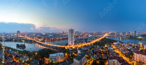 Aerial skyline view of Hanoi at Linh Dam lake, Belt Road No. 3. Hanoi cityscape by sunset period