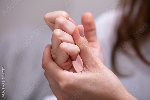 Woman Cracking Their Knuckles