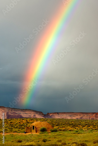 USA, Utah, Monument Valley Navajo Tribal Park. Rainbow over a Navajo hogan.