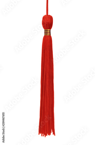 Red tassel isolated on white background.