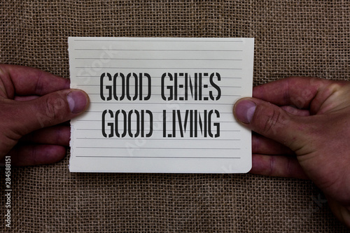 Text sign showing Good Genes Good Living. Conceptual photo Inherited Genetic results in Longevity Healthy Life Man holding piece notebook paper jute background Communicating ideas