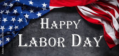 US American flag on worn black background. For USA Labor day celebration. With Happy Labor Day text.
