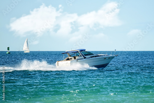 modern powerboat speeding on lake