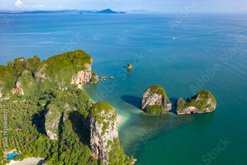 Aerial view of tropical island, turquoise lagoon and islands on horizon, Krabi, Railay, Thailand.Travelling and holiday concept.