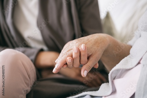 Caregiver holding the hand