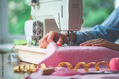 Electric sewing machine and different sewing accessories during sewing process