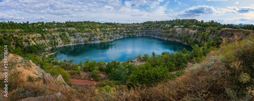 Lake in an abandoned quarry. Panorama. Top view.